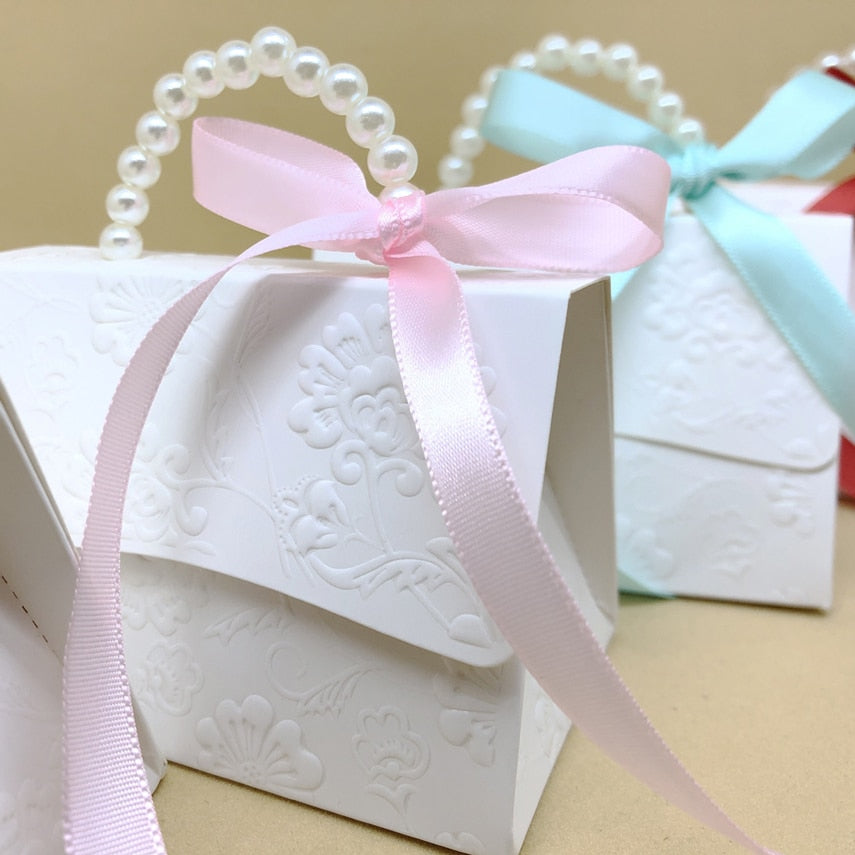 Marble pattern party favor gift boxes with faux pearl handles and decorative ribbons. — view 3