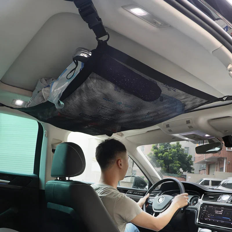 Black SUV ceiling storage net cargo organizer made of breathable mesh with adjustable attachment buckles — view 5