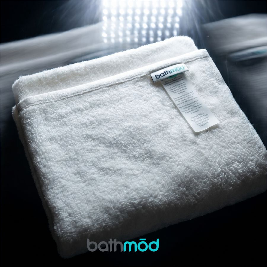 Luxury organic Turkish cotton bath mats in a four pack, featuring plush undyed fabric.