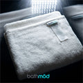 Luxury organic Turkish cotton bath mats in a four pack, featuring plush undyed fabric.