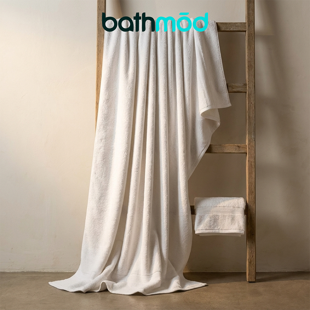 Luxury organic bath sheets in natural white, folded two-pack made of plush Turkish cotton.