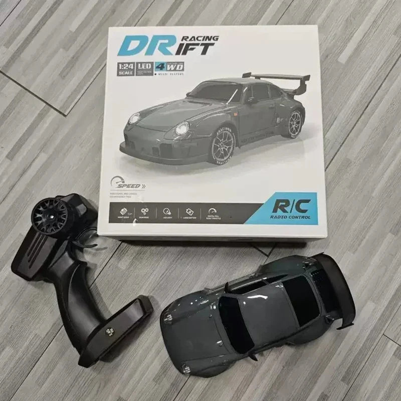 High-speed 1/20 scale RC drift car in durable plastic with remote controller, battery, and road barriers