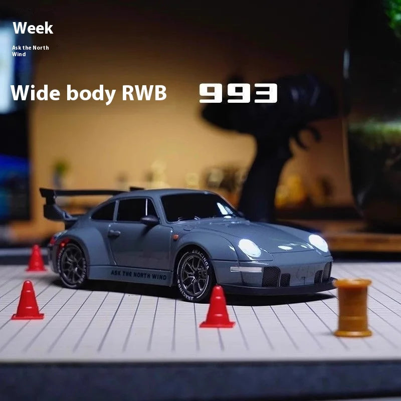High-speed 1/20 scale RC drift car in durable plastic with remote controller, battery, and road barriers — view 2