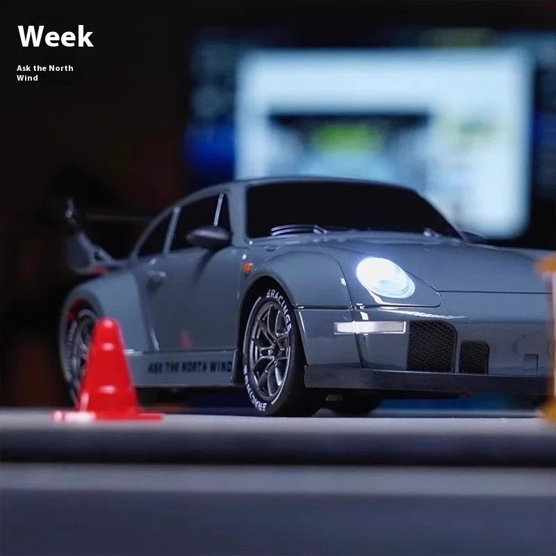 High-speed 1/20 scale RC drift car in durable plastic with remote controller, battery, and road barriers — view 3