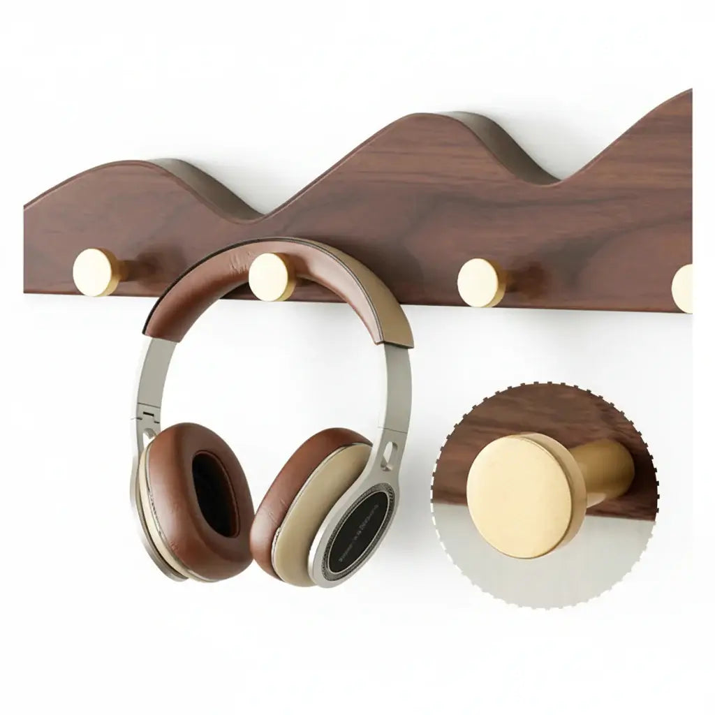 Wooden mountain shape wall hook rack with multiple foldable pegs mounted on a white wall — view 3