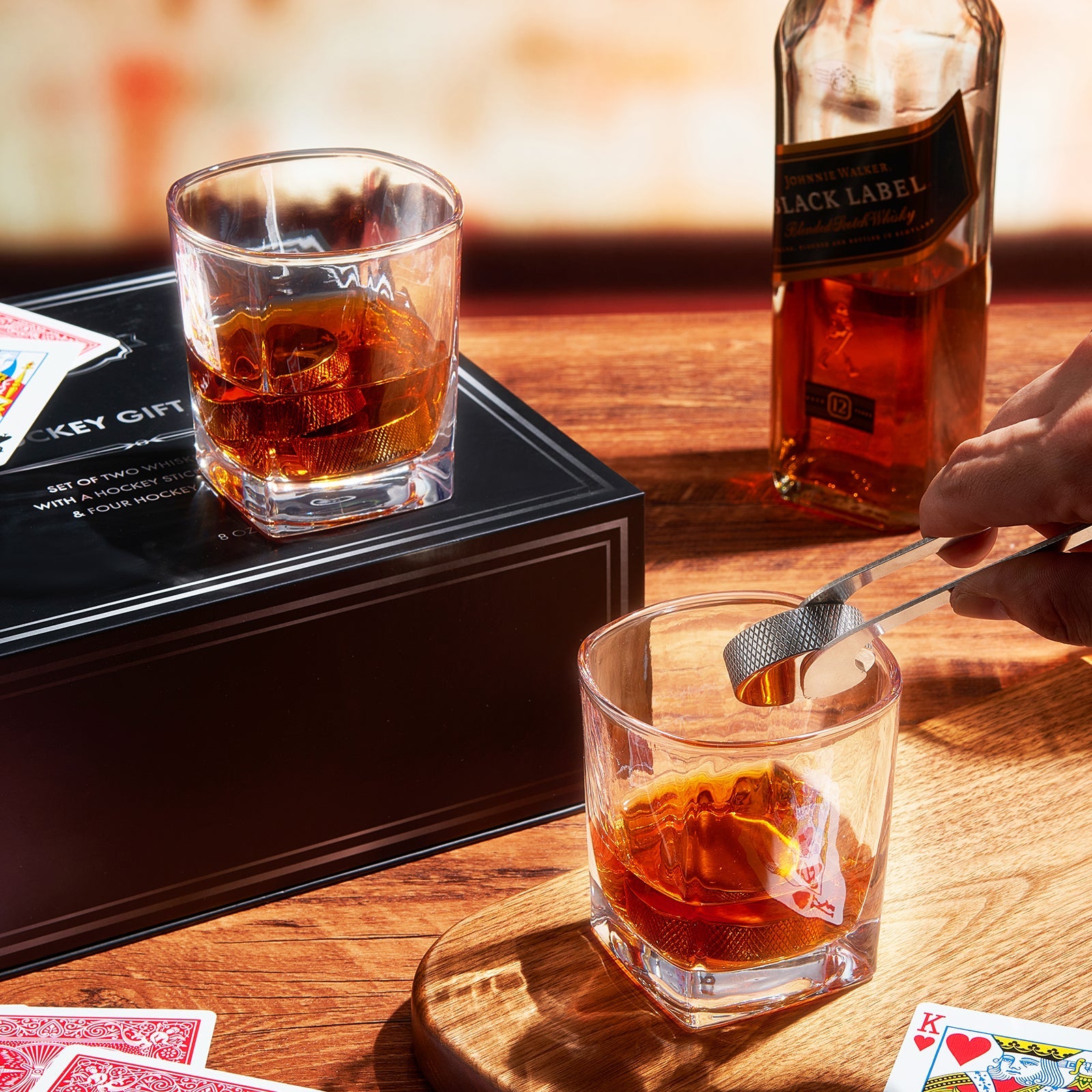 7-piece stainless steel hockey puck whiskey stones set with glasses and stick tongs — view 4