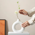 Modern Nordic circle ceramic vase in matte white, minimalist hollow sculptural decor for dried flowers