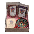 Self-care gift box by Mother Earth featuring cacao, rose petals, blue lotus, and ceramic mug