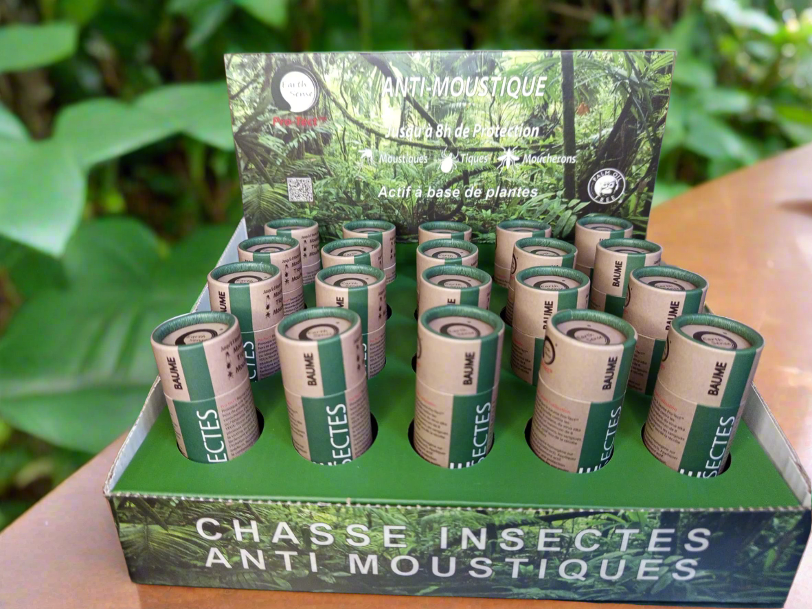 Natural insect repellent balm push-up tubes in a twenty-piece retail display box for outdoor protection.