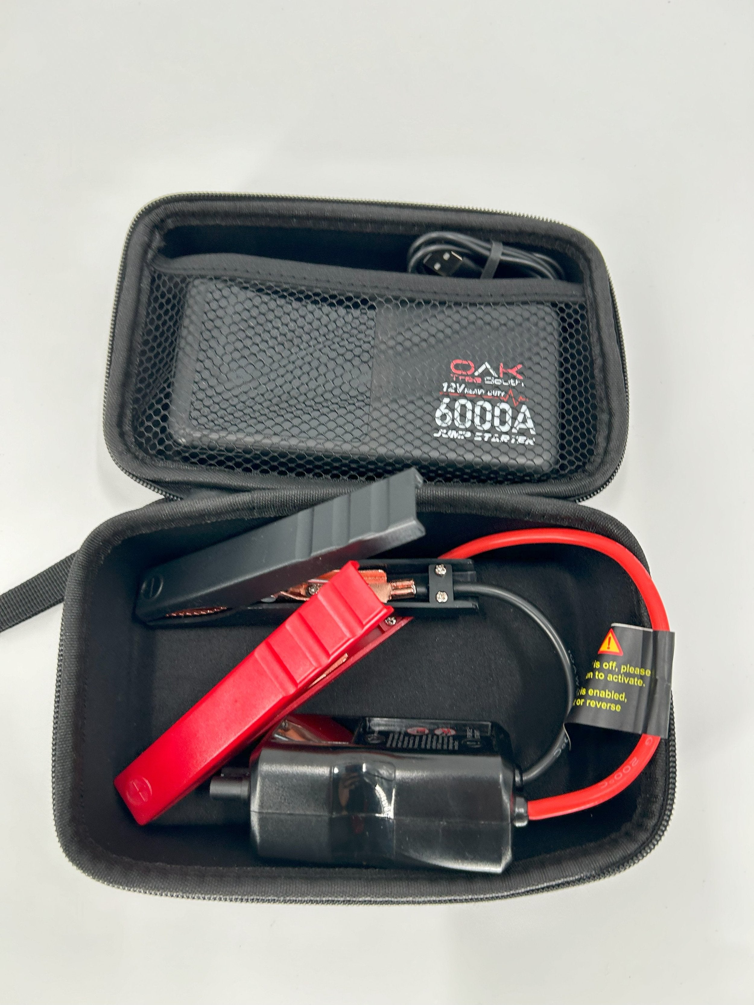 Heavy duty 6000A portable battery jumper pack with multiple charging ports and integrated LED flashlight — view 7