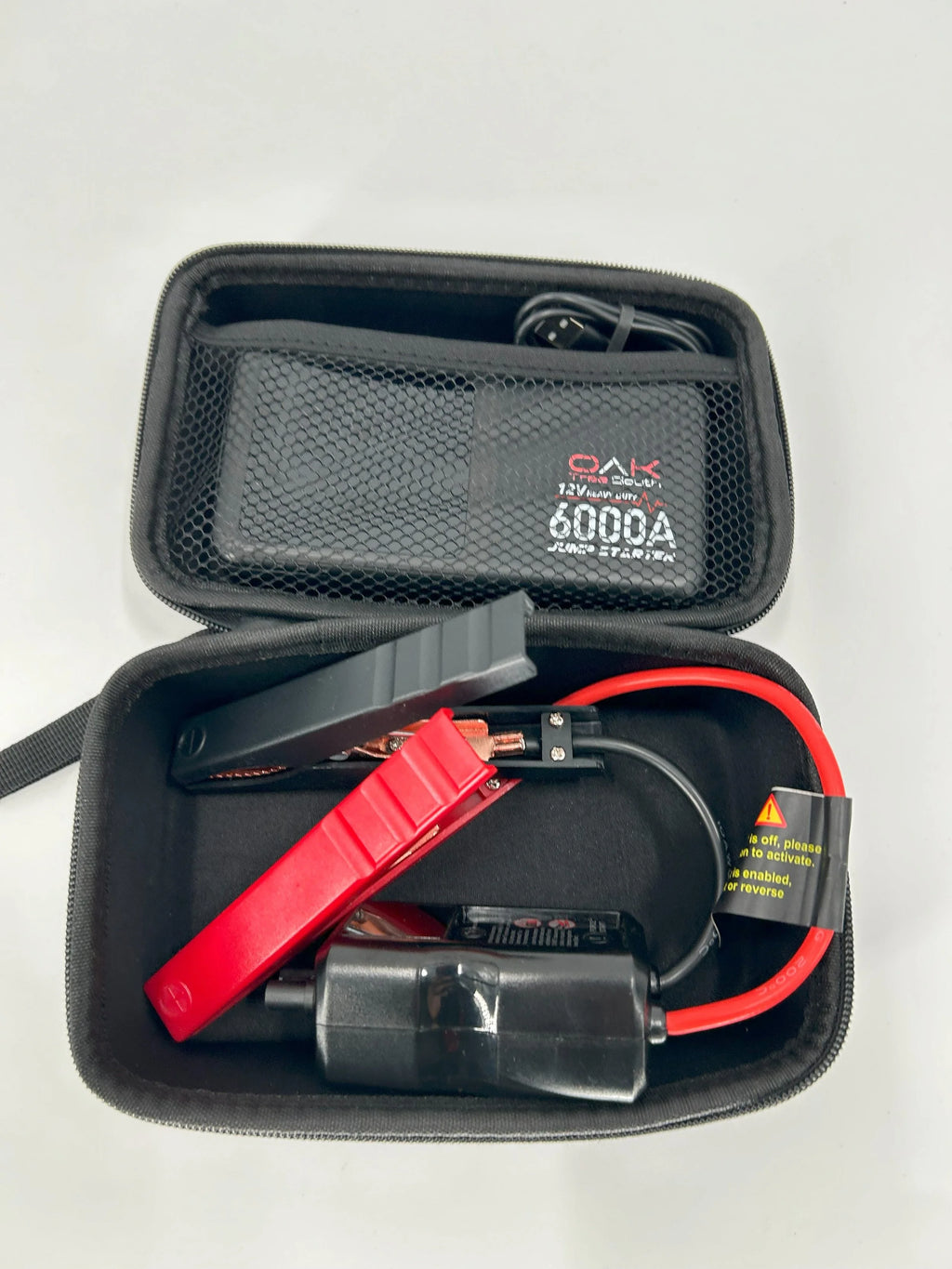 Heavy duty 6000A portable battery jumper pack with multiple charging ports and integrated LED flashlight — view 7