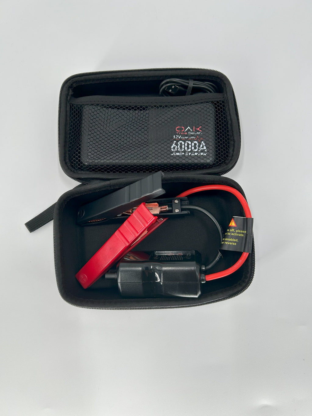 Heavy duty 6000A portable battery jumper pack with multiple charging ports and integrated LED flashlight — view 6