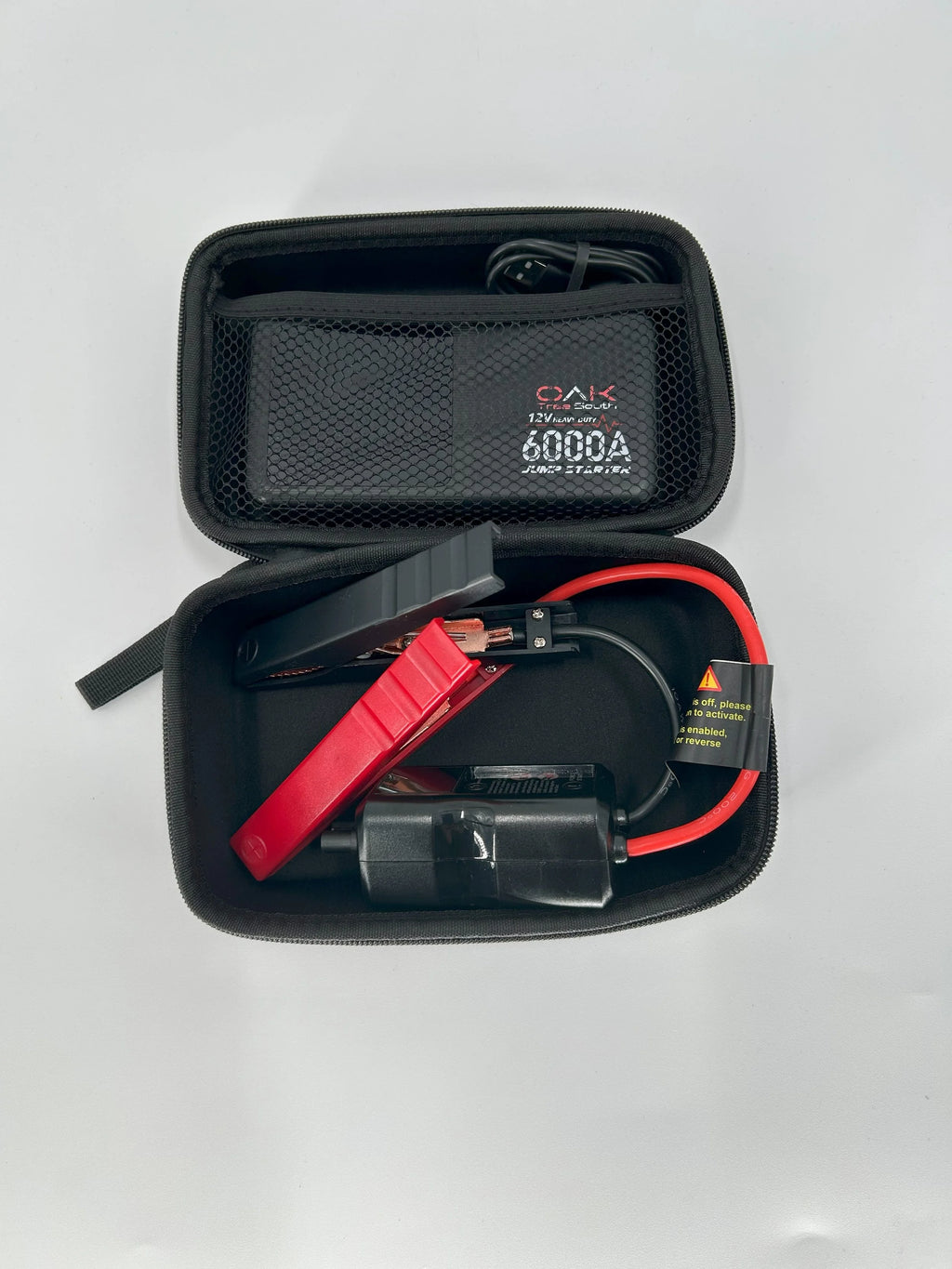 Heavy duty 6000A portable battery jumper pack with multiple charging ports and integrated LED flashlight — view 6