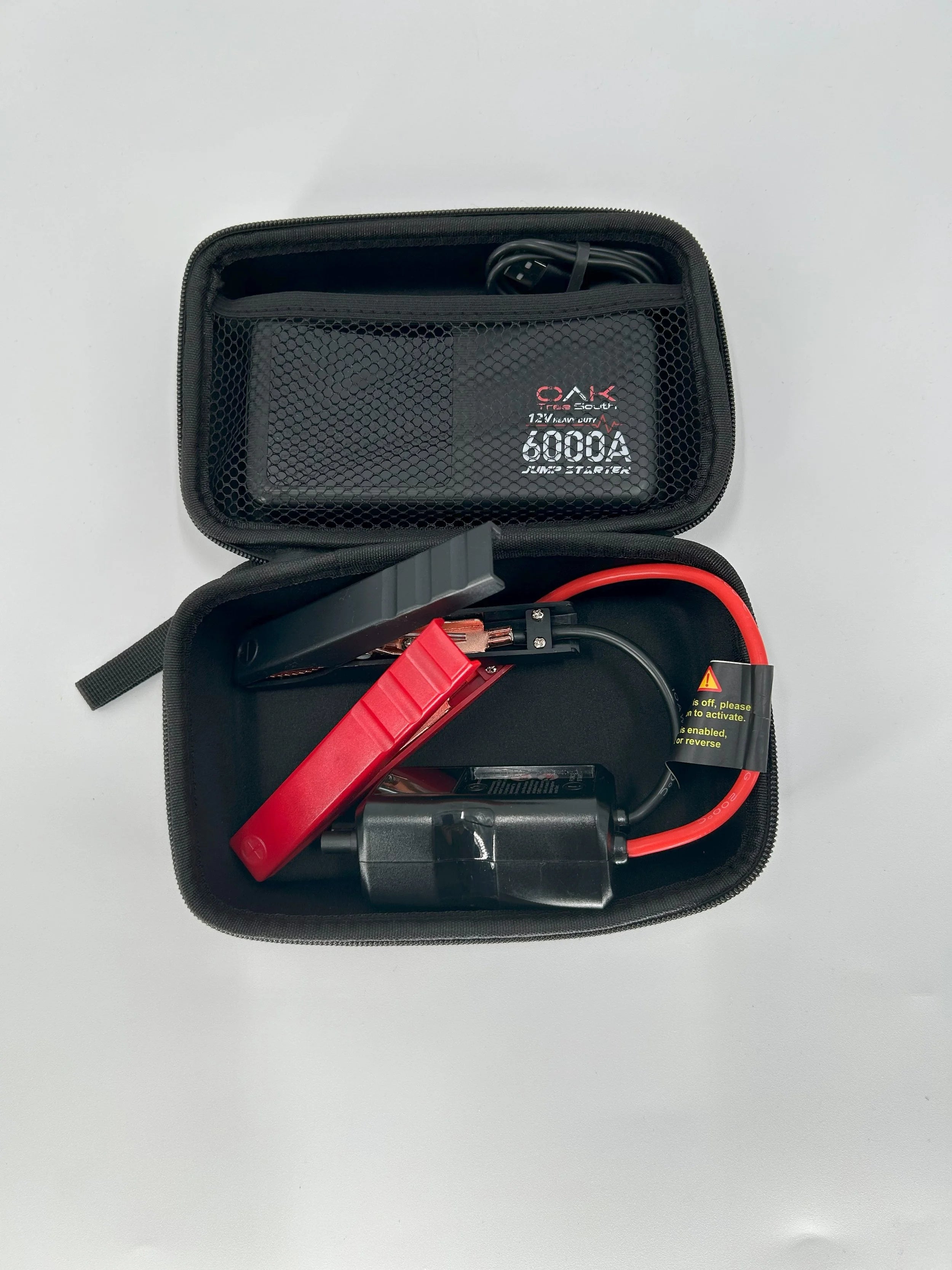 Heavy duty 6000A portable battery jumper pack with multiple charging ports and integrated LED flashlight — view 6