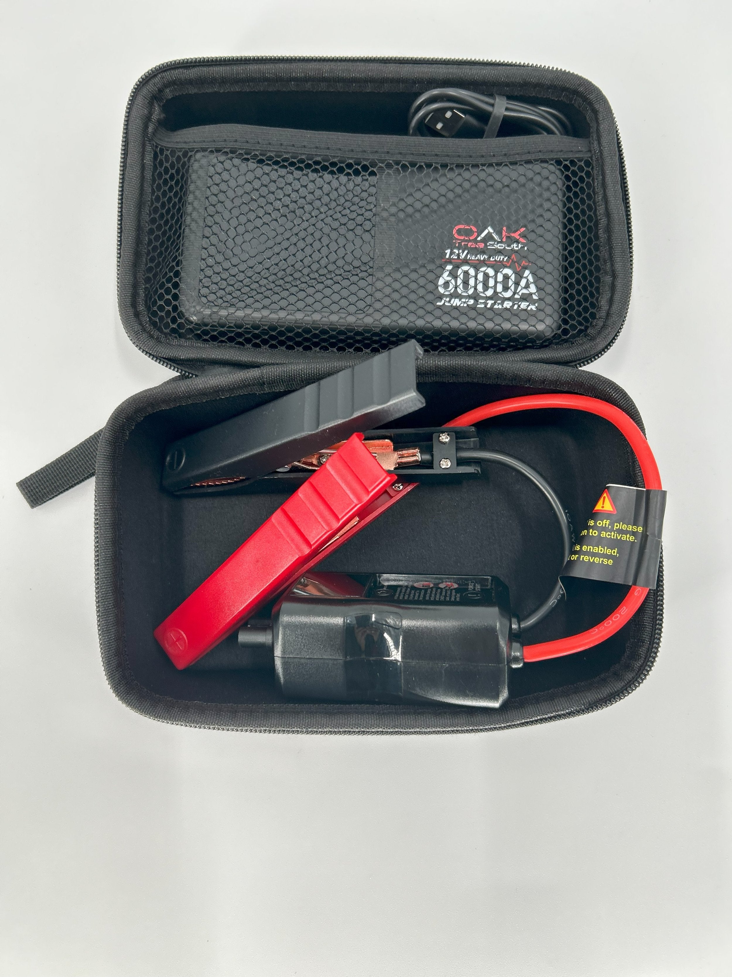 Heavy duty 6000A portable battery jumper pack with multiple charging ports and integrated LED flashlight — view 4