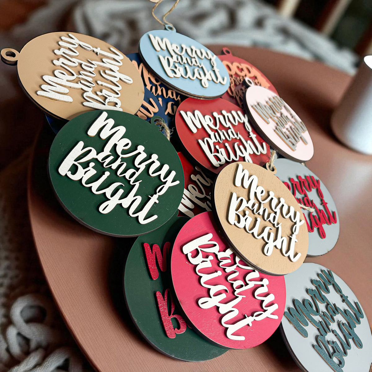 Merry and Bright wooden Christmas ornament with 3D lettering and rustic jute hanging string — view 3