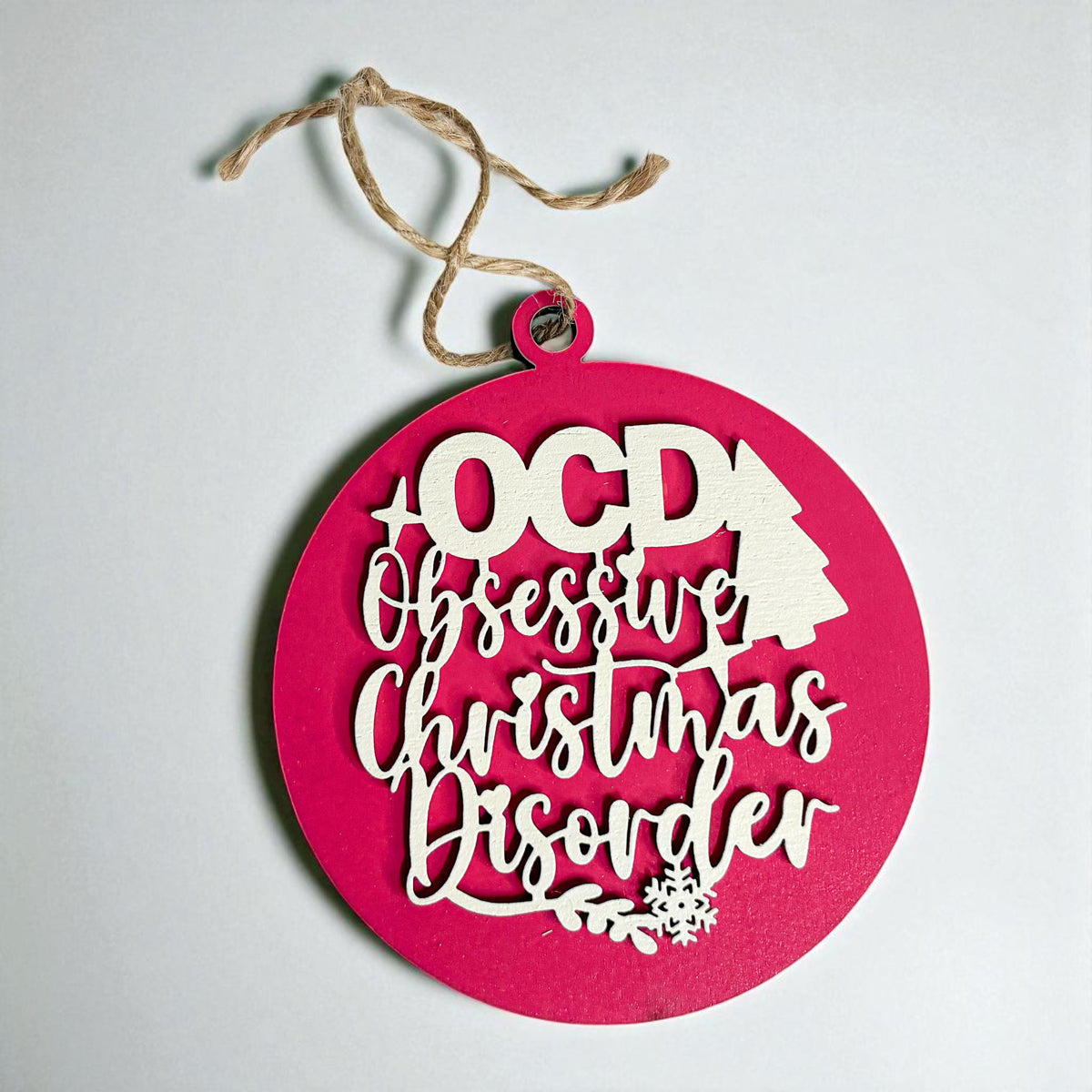 Obsessive Christmas Disorder round wooden ornament with a 3D tree and snowflakes — view 2