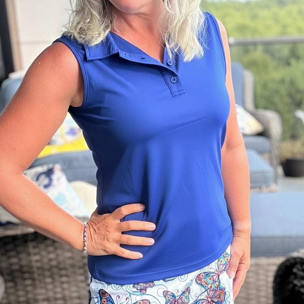 Women's sleeveless purple golf polo shirt with button-up collar and breathable moisture-wicking fabric — view 3