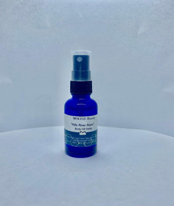 Blue Nile Atum body oil spray bottle with organic cucumber and blueberry seed oil extract — view 2