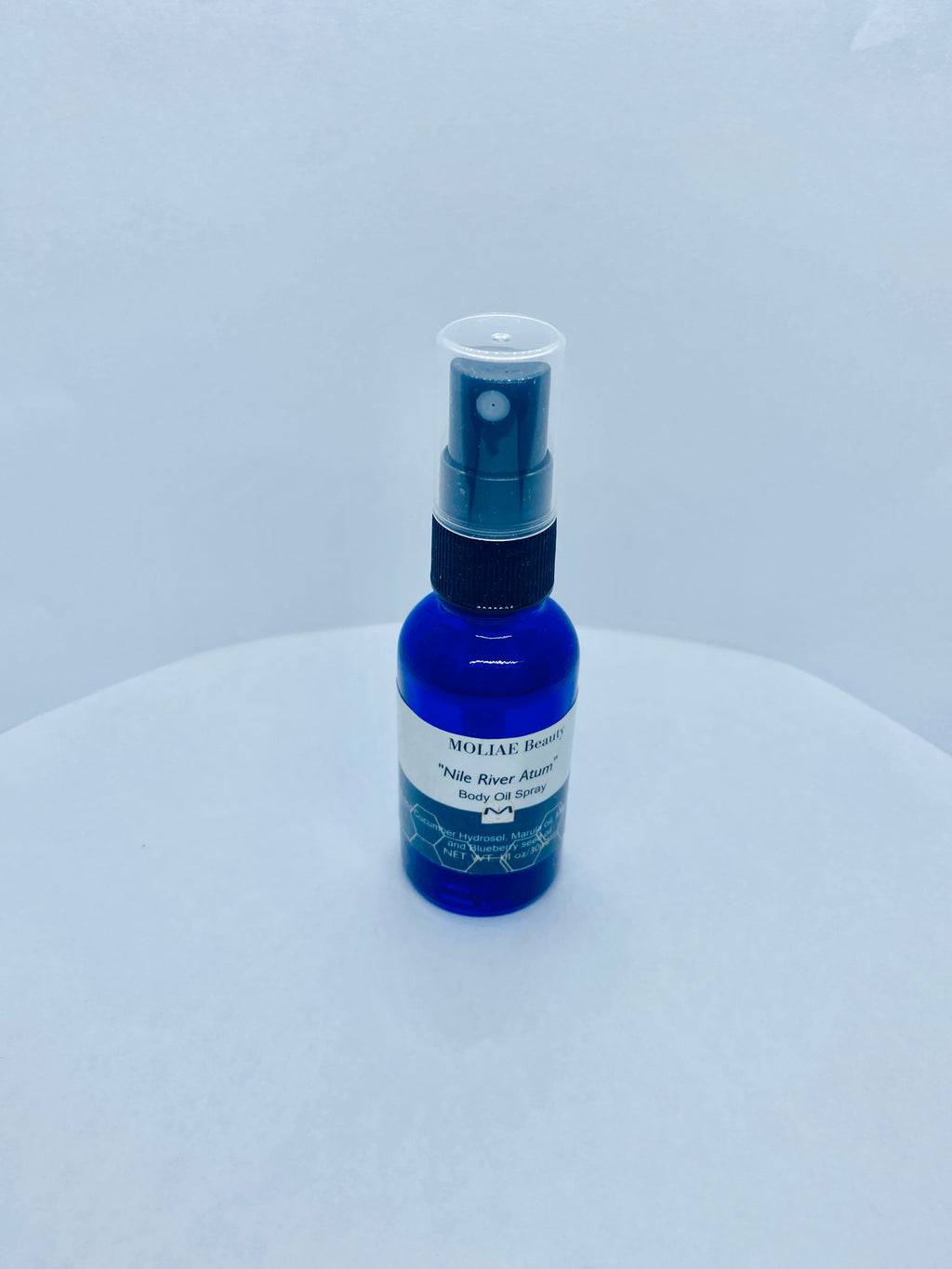 Blue Nile Atum body oil spray bottle with organic cucumber and blueberry seed oil extract — view 5