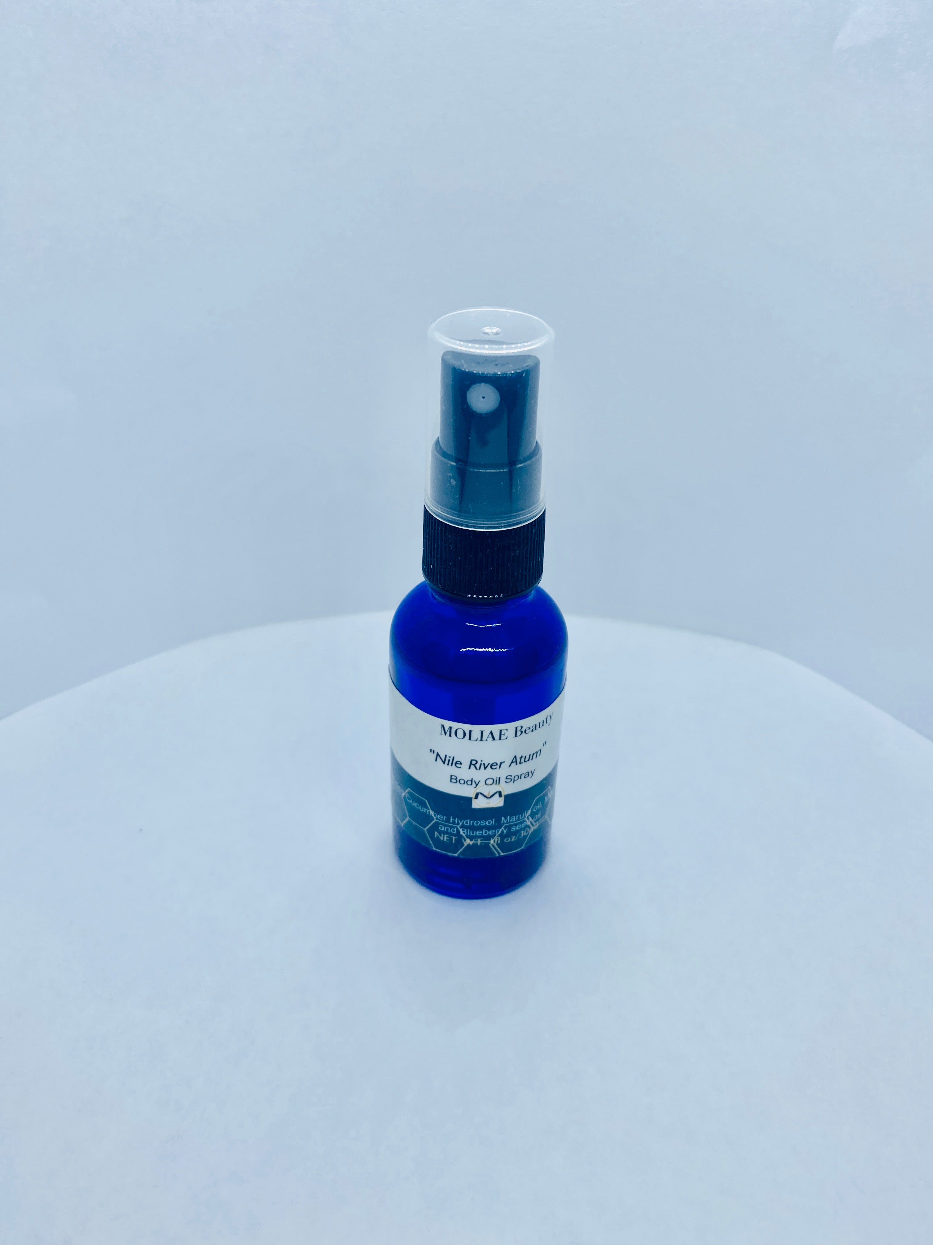 Blue Nile Atum body oil spray bottle with organic cucumber and blueberry seed oil extract — view 5