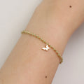 Gemstone butterfly charm stretch bracelet with delicate beads and a miniature metallic butterfly pendant