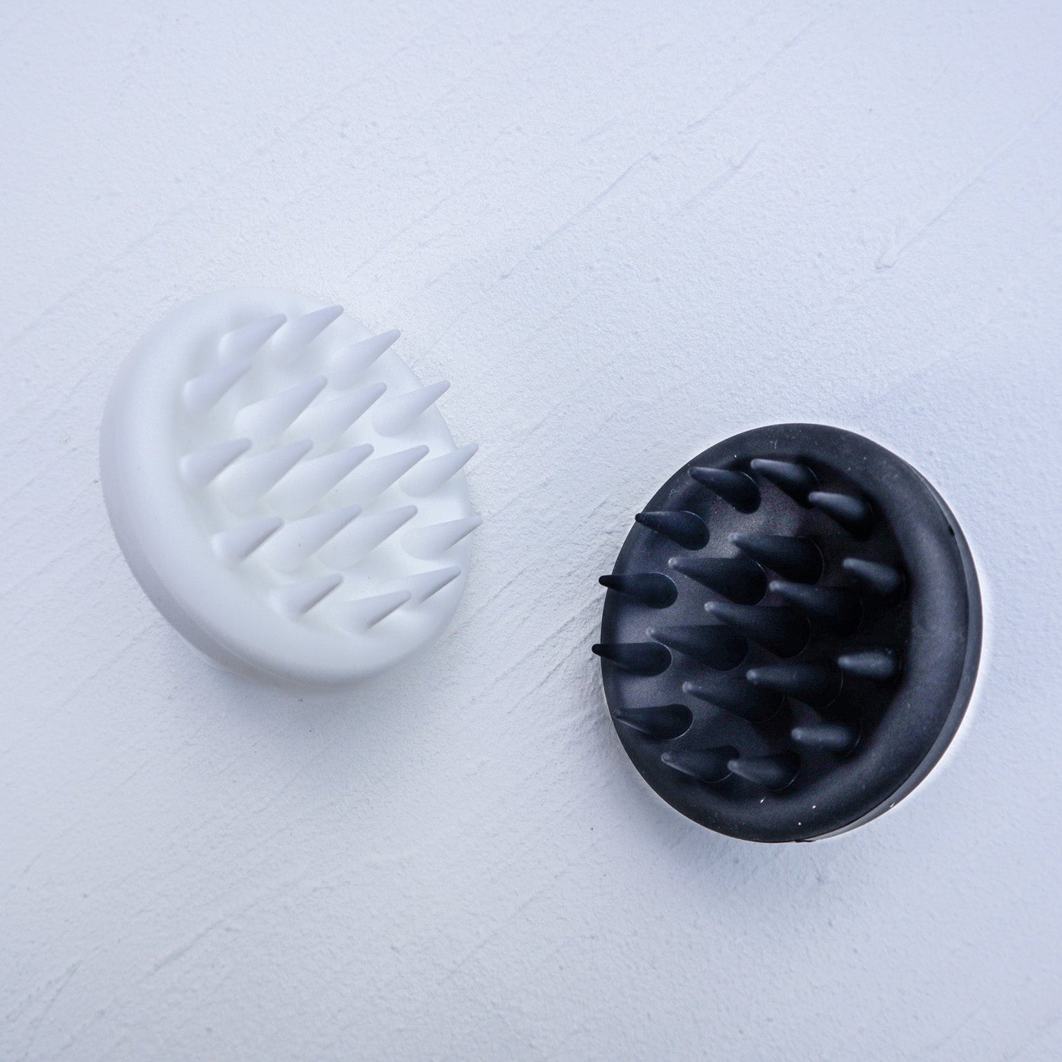 Ergonomic silicone scalp massager shampoo brush with soft bristles and grip handle