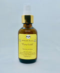 Pyra Gold body glow oil spray bottle with 24kt gold leaflets and Moroccan Argan oil
