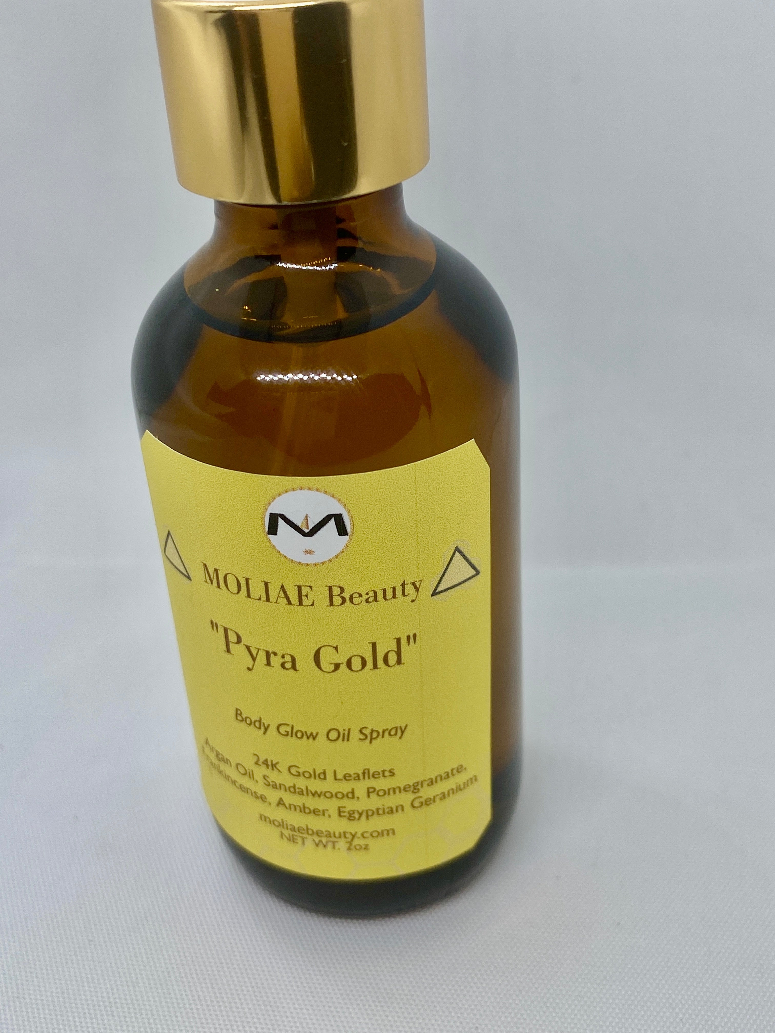Pyra Gold body glow oil spray bottle with 24kt gold leaflets and Moroccan Argan oil — view 2
