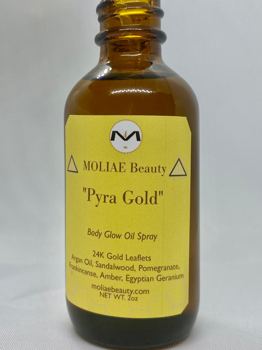Pyra Gold body glow oil spray bottle with 24kt gold leaflets and Moroccan Argan oil — view 5