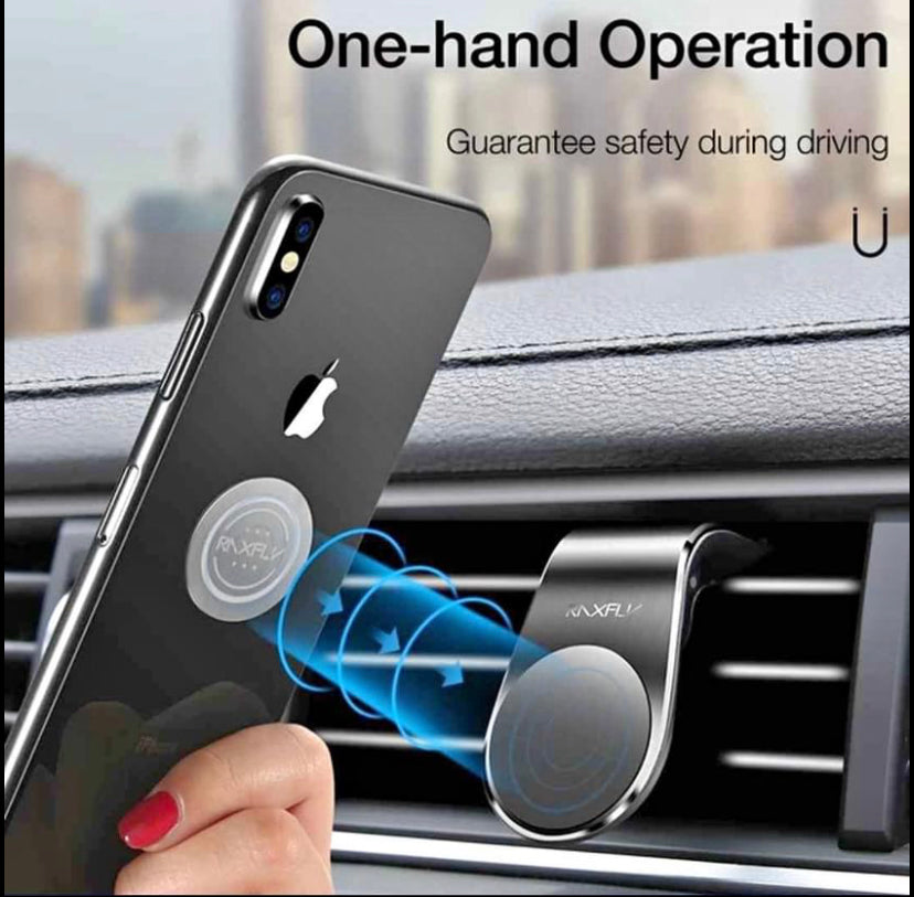 Black magnetic air vent car cell phone holder attached to a vehicle dashboard air vent — view 2