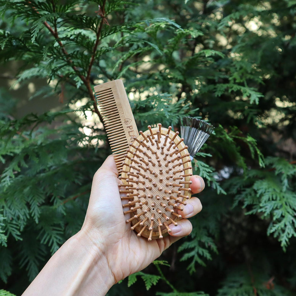 On-the-go bamboo hair brush set with detangling comb, cleaning tool, and reusable travel bag. — view 2