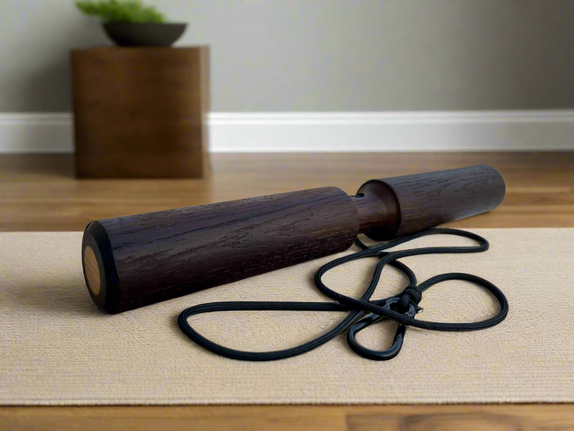 Smoked oak wrist roller with attached black rope and metal carabiner for grip strength training