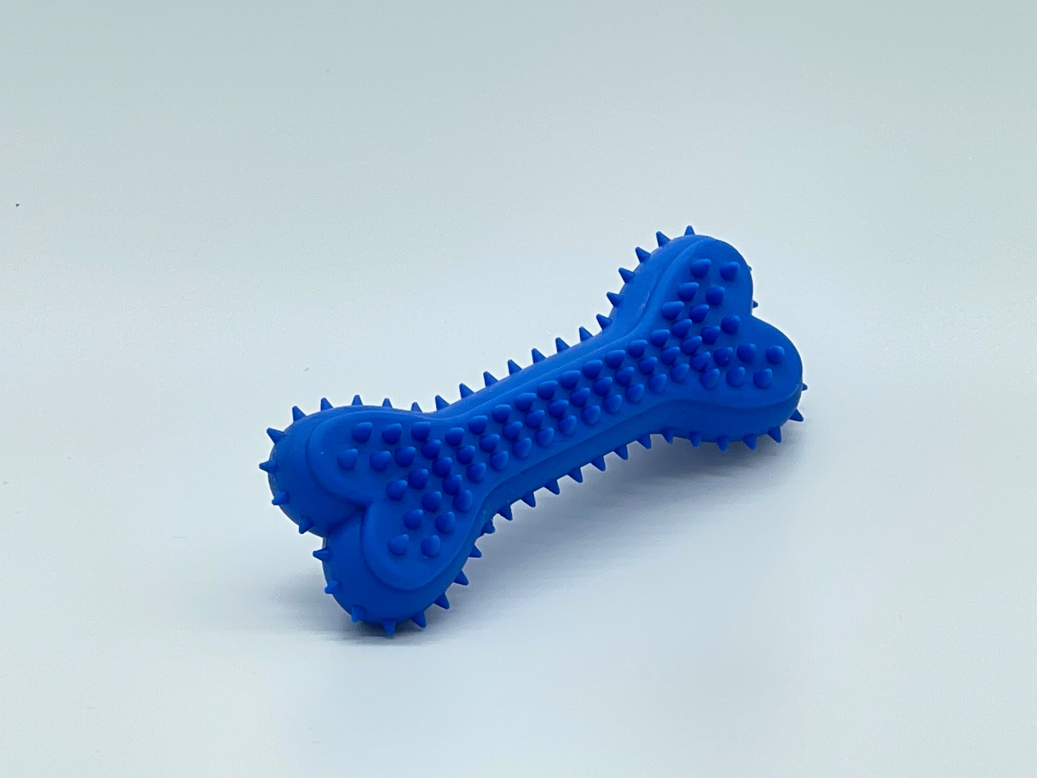 Flexible non-toxic plastic chewer bone dog toy in vibrant color for active small breeds — view 4