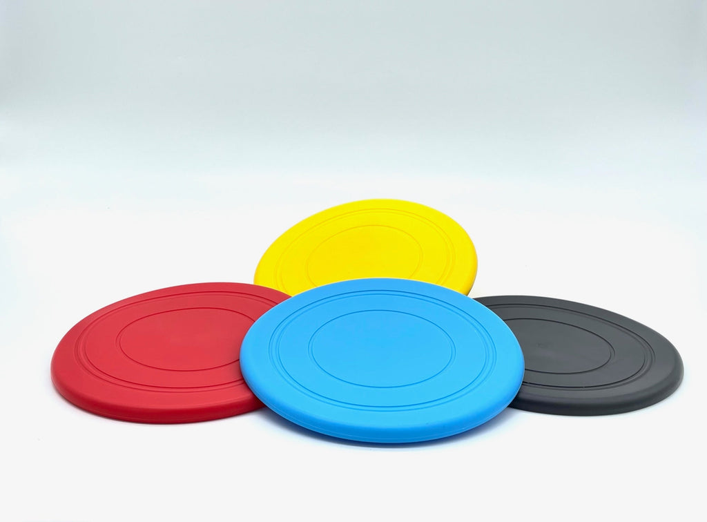 Fetch Me Frisbee dog toy, non-toxic flexible plastic flying disc for outdoor catch games.