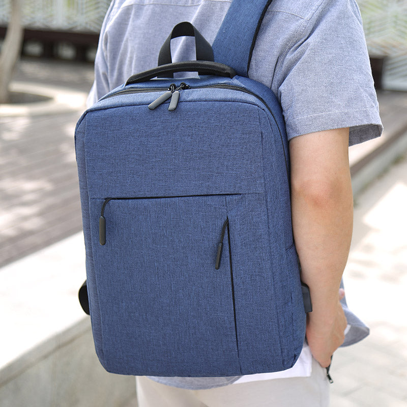 Premium grey minimalist travel backpack with padded straps and sleek modern design for daily commute