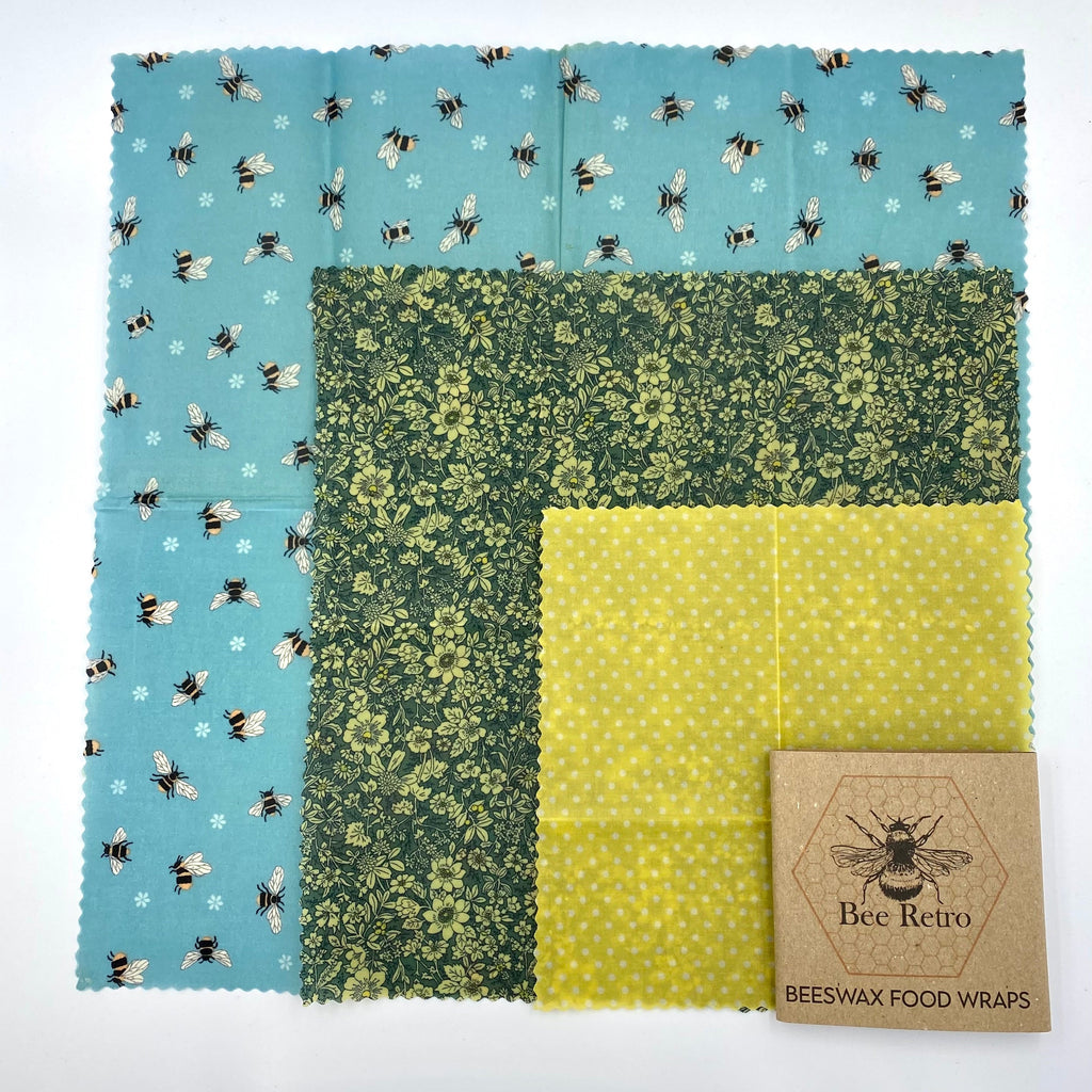 Reusable blue bee floral beeswax food wrap covering a sandwich and ceramic bowl — view 3