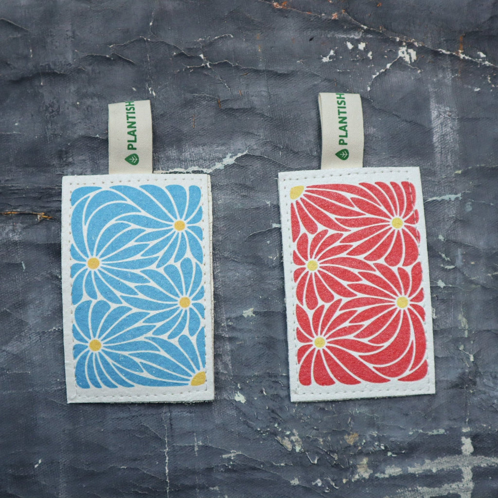 Blue Daisy compostable eco sponge with wood pulp, textured loofah, and a blue floral print pattern — view 4