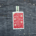 Red daisy print eco sponge made of natural loofah and wood pulp for kitchen dishwashing