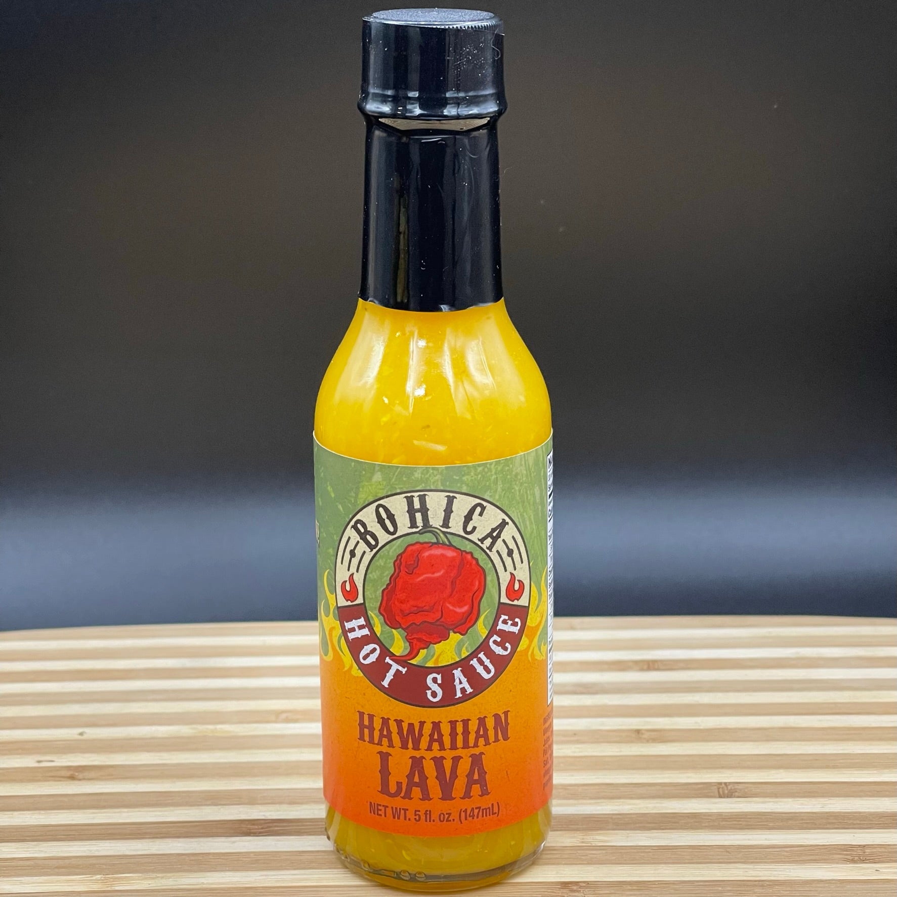 Bottle of Bohica Hawaiian Lava hot sauce with a blend of tropical fruits and spicy peppers — view 4