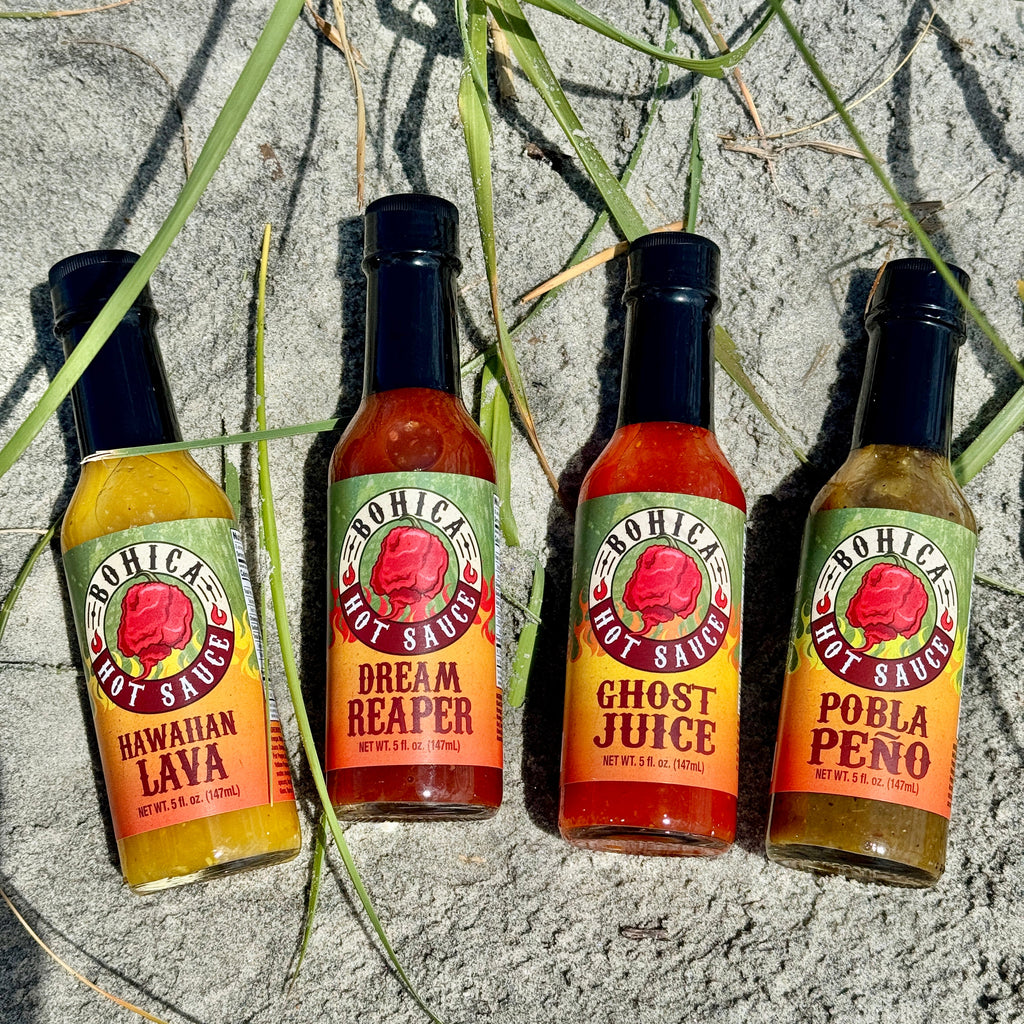 Bohica hot sauce four pack gift set featuring four glass bottles with colorful flavor labels — view 3