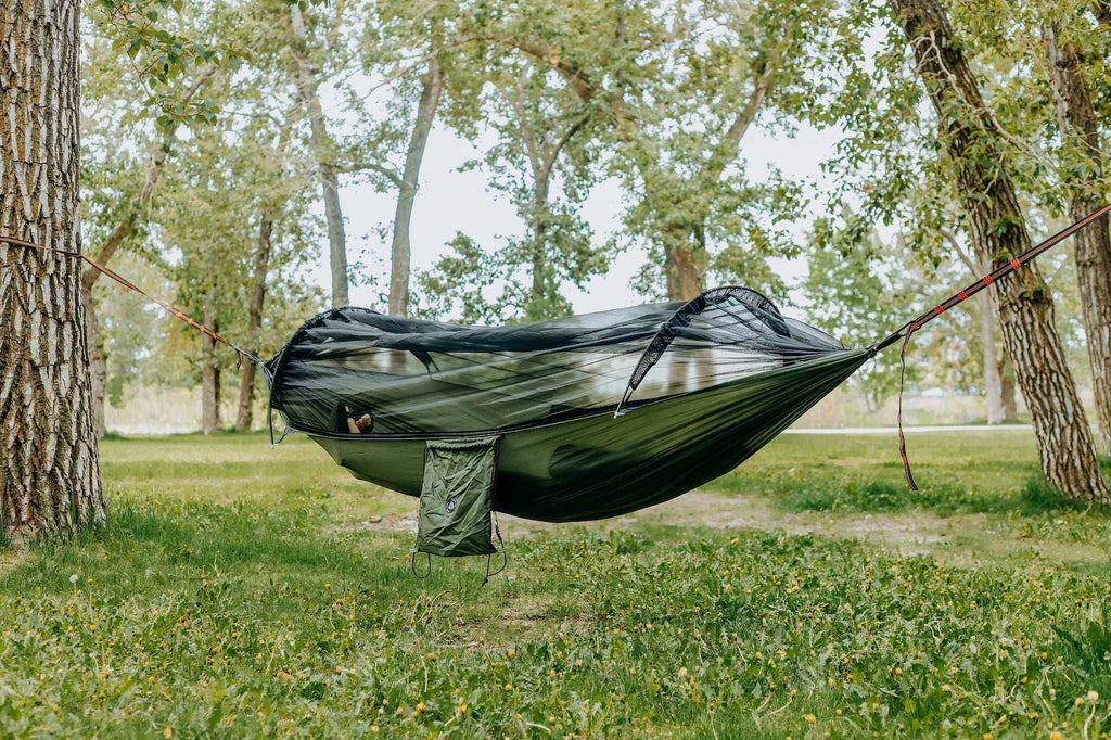 Portable camping hammock in ripstop nylon with built-in mosquito net and aluminum support poles — view 2