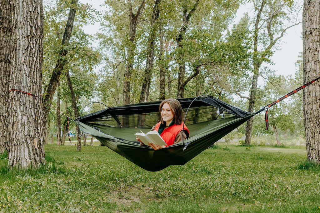 Portable camping hammock in ripstop nylon with built-in mosquito net and aluminum support poles — view 3