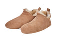 Beige adult natural sheepskin boots with genuine leather sole on a clean background
