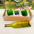 Green eco-friendly holiday gift set with upcycled wine glasses, glass platter, and spruce scented candle