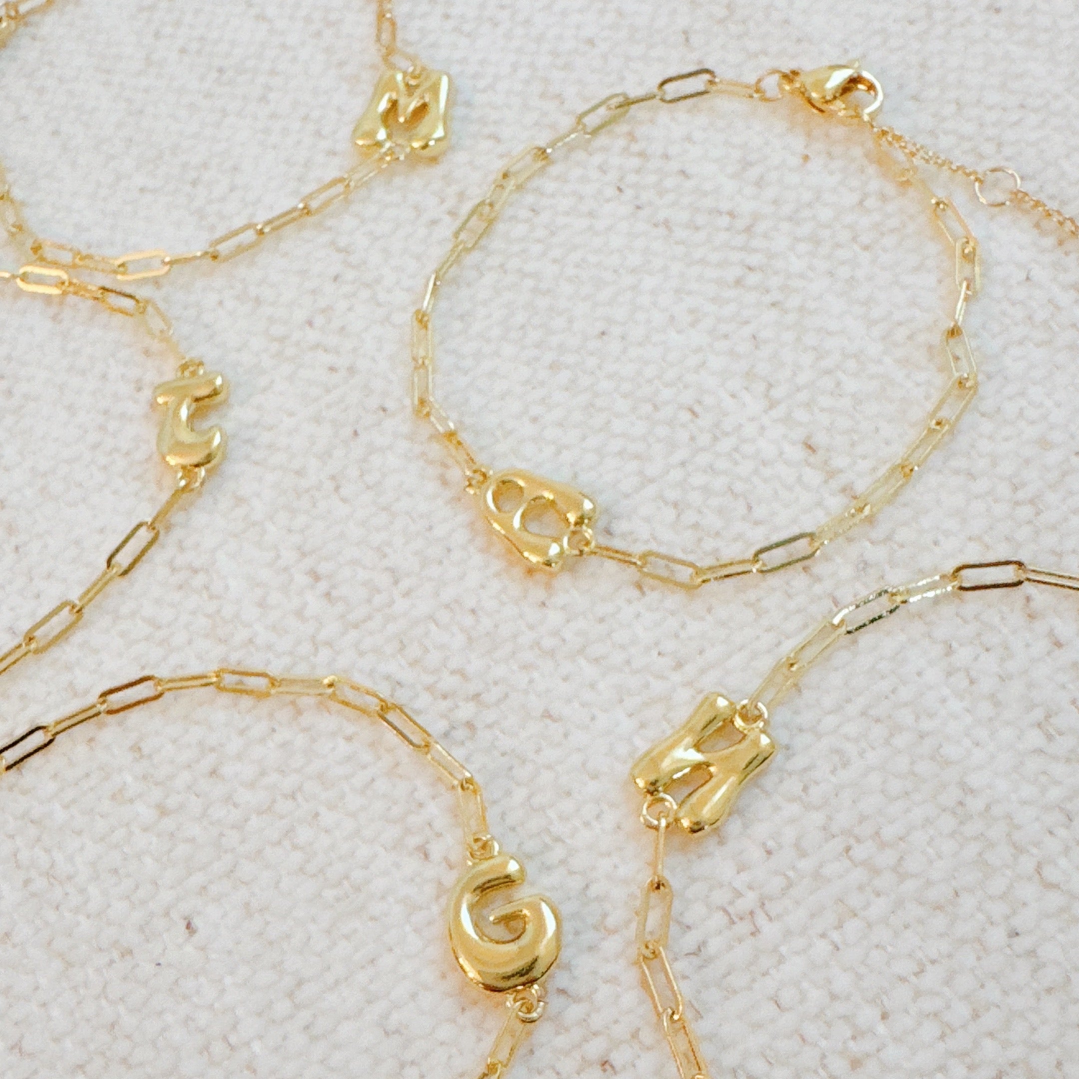 18k gold plated mini balloon initial bracelet on a delicate chain with adjustable extender — view 3