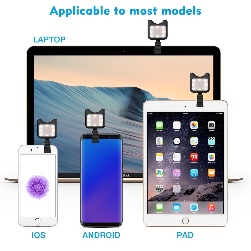 Black clip-on universal phone camera lens and selfie LED light attached to a smartphone — view 2