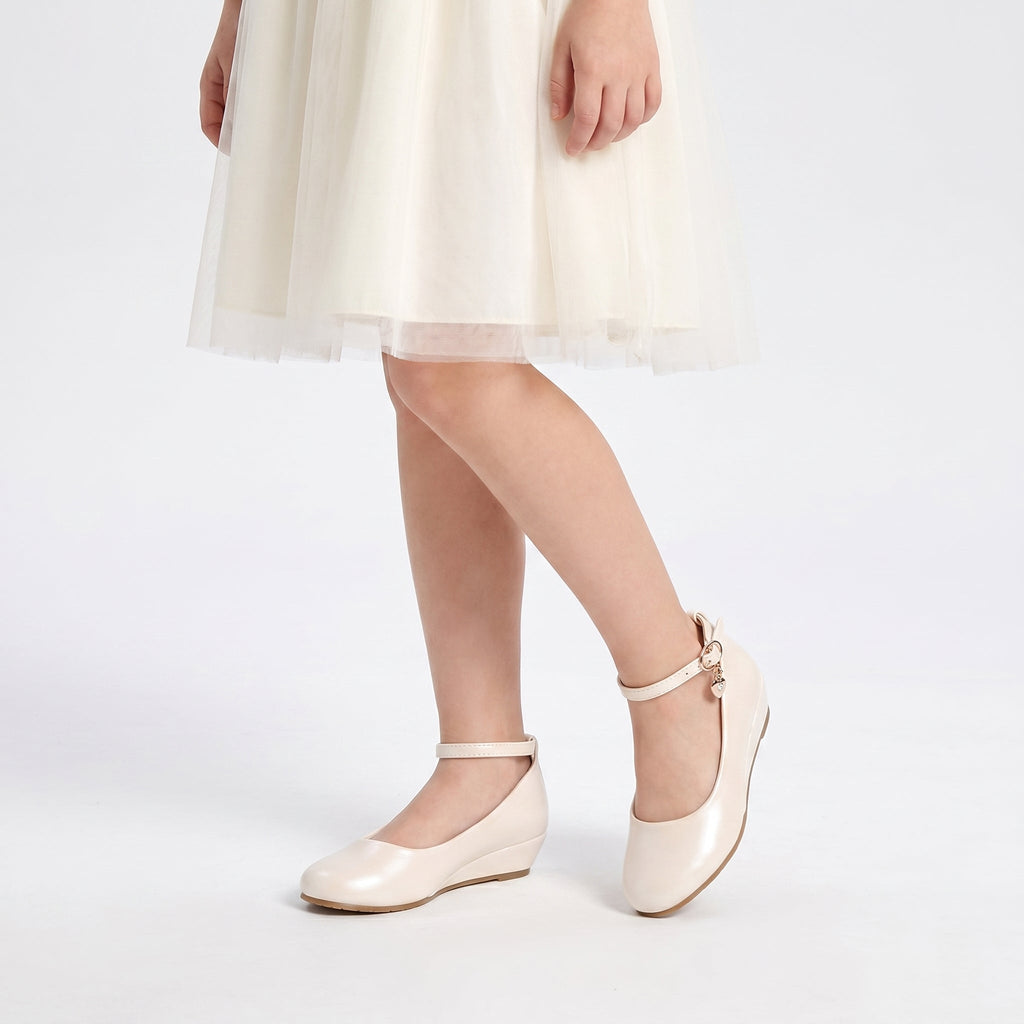 Girls faux leather wedge shoes with a big bow detail, perfect for elegant formal occasions. — view 2