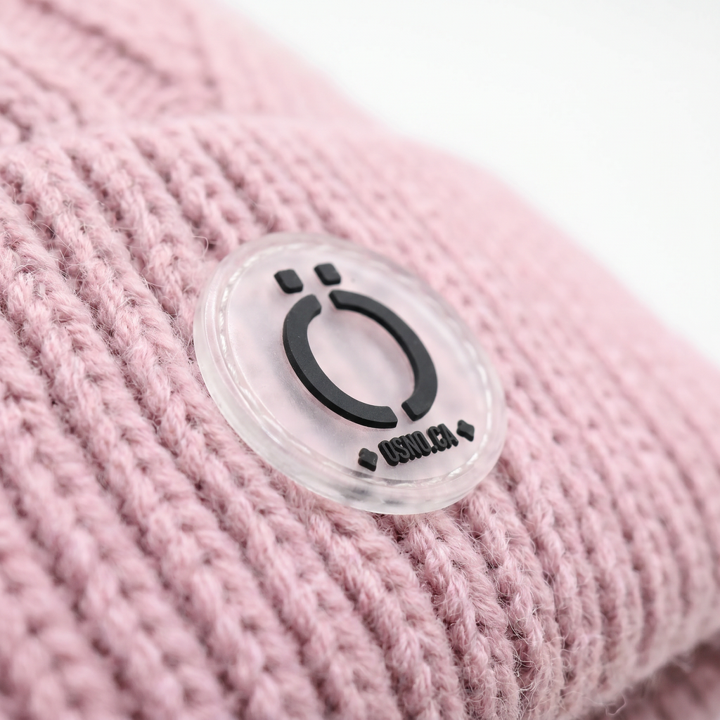 Blush pink kids knit winter tuque hat featuring a soft removable long fur pompom — view 2