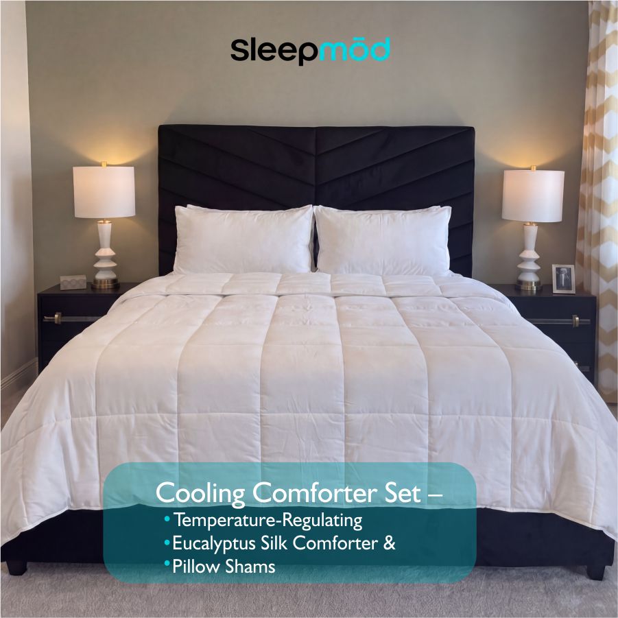 White eucalyptus silk cooling comforter and two matching quilted pillow shams neatly arranged on bed — view 2